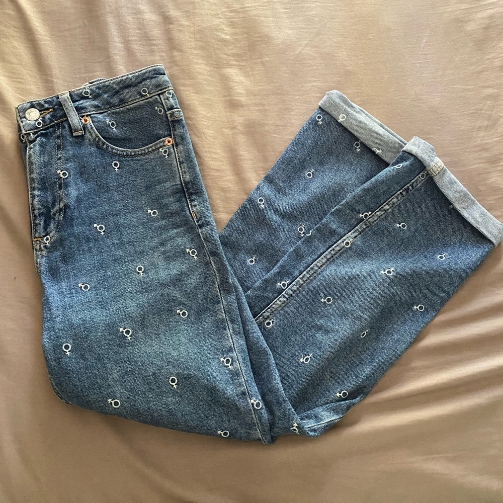 Top shop denim jeans. Embroidered gender signs.